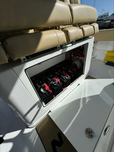  Yacht Photos Pics Open compartment on a 2023 Sportsman boat revealing batteries and wiring.