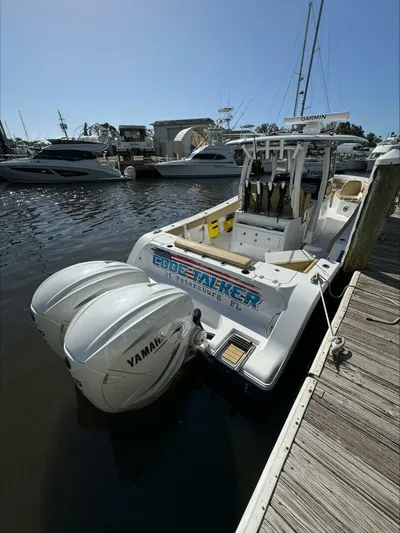  Yacht Photos Pics A 2023 Sportsman boat docked with twin Yamaha engines in a marina.