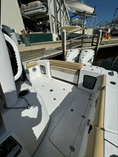  Yacht Photos Pics 2023 Sportsman boat interior with dual engines docked at marina.