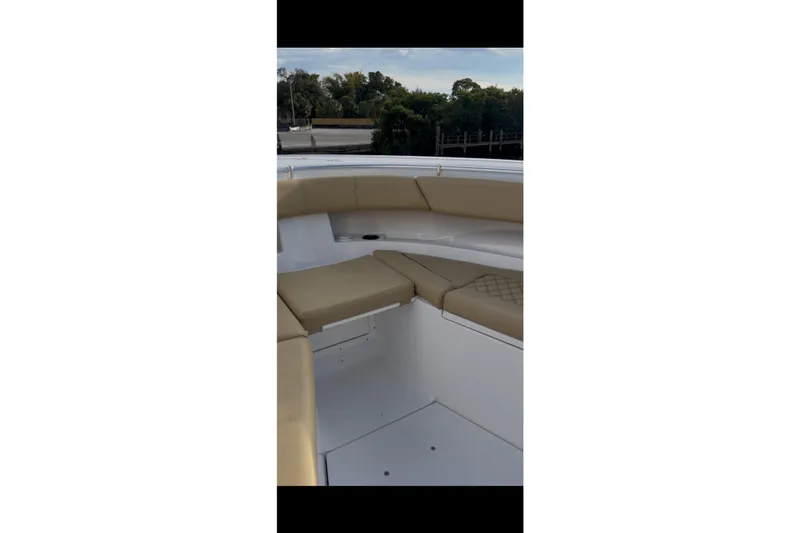  Yacht Photos Pics 2023 Sportsman Open 322 Center Console boat interior with tan seating and white deck.