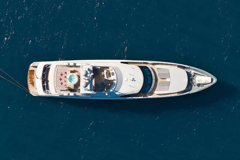  Yacht Photos Pics Aerial view of 2007 Baglietto 43 yacht on blue ocean waters.