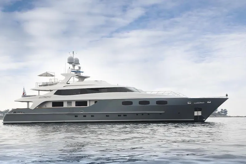  Yacht Photos Pics Luxury 2007 Baglietto 43 yacht on calm waters under a cloudy sky.