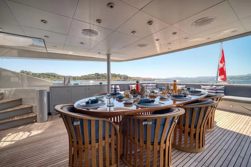  Yacht Photos Pics Luxurious dining area on 2007 Baglietto 43 yacht with scenic ocean view.