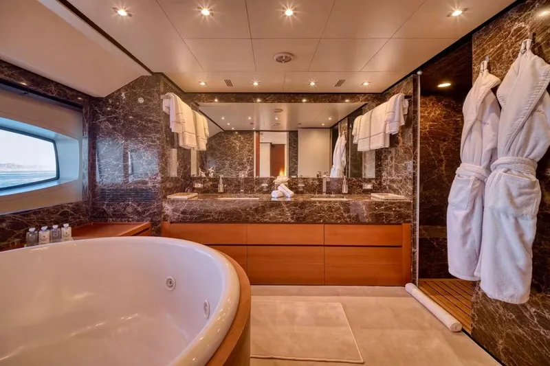  Yacht Photos Pics Luxurious bathroom on 2007 Baglietto 43 yacht with marble decor and jacuzzi tub.