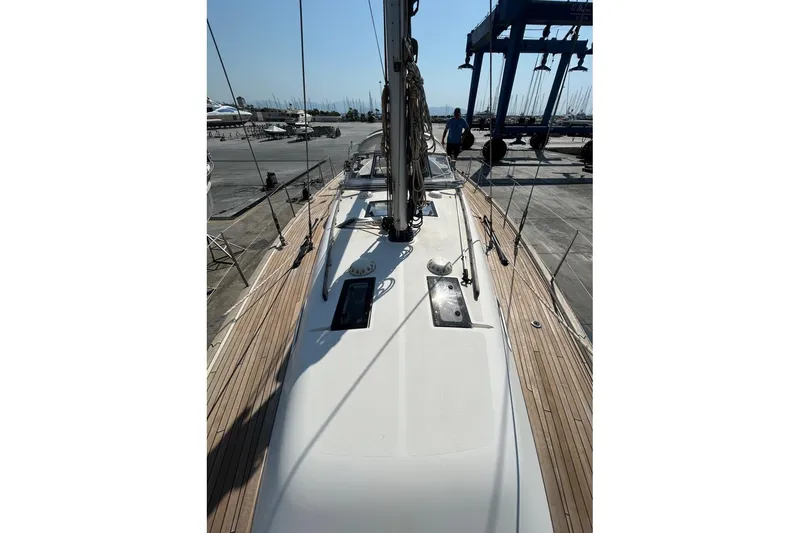 Magic I Yacht Photos Pics Hallberg-Rassy 44 yacht, 2021 model, docked with wooden deck and rigging visible.