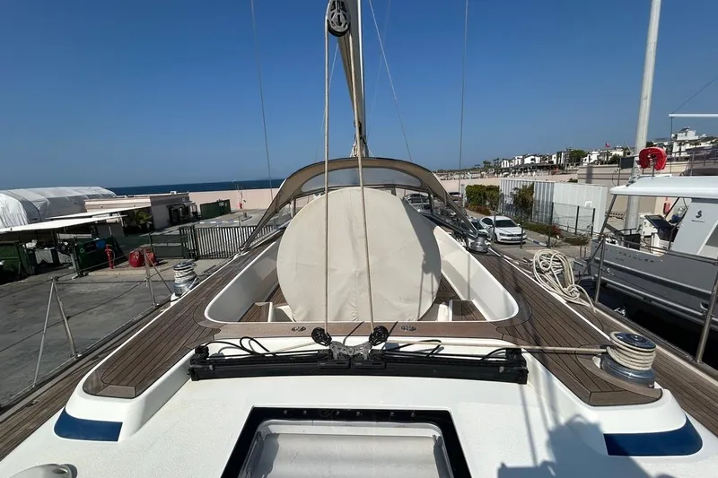 Magic I Yacht Photos Pics 2021 Hallberg-Rassy 44 yacht deck with ocean view, docked at marina.