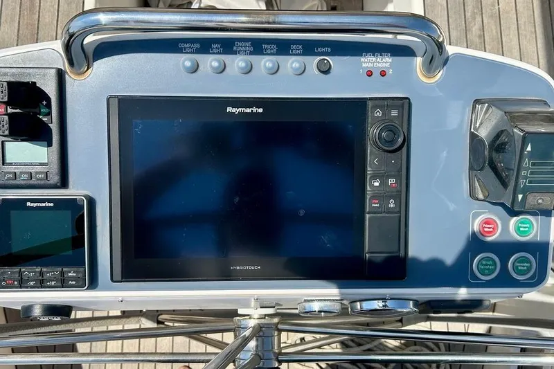 Magic I Yacht Photos Pics Control panel of a 2021 Hallberg-Rassy 44 yacht with Raymarine navigation system.