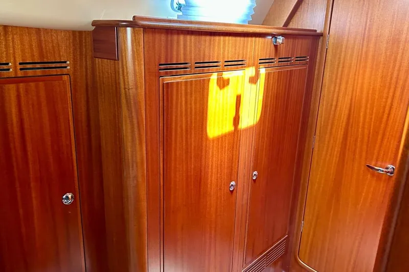 Magic I Yacht Photos Pics Luxurious wooden interior of 2021 Hallberg-Rassy 44 yacht cabin.