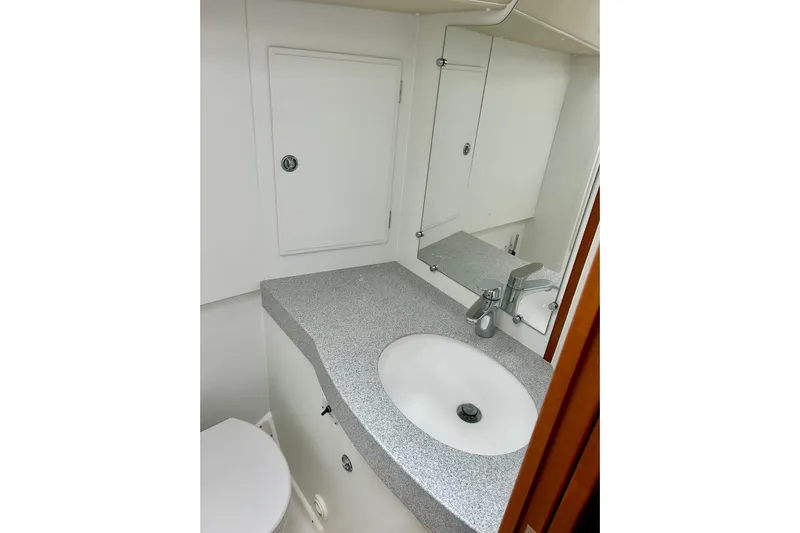 Magic I Yacht Photos Pics Bathroom interior of 2021 Hallberg-Rassy 44 yacht with sink and mirror.