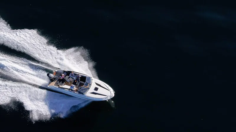  Yacht Photos Pics 2024 Skamander 850 Voyager speedboat cruising on open water.