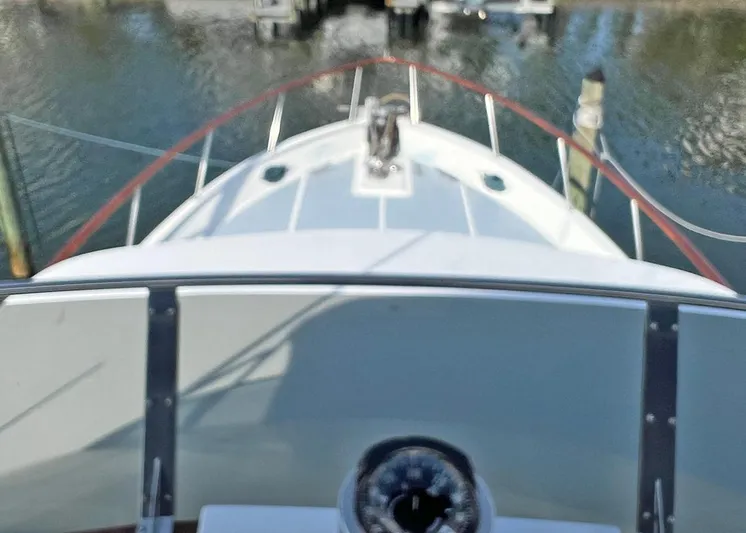  Yacht Photos Pics 1987 DeFever Tri-Cabin yacht bow view at marina.