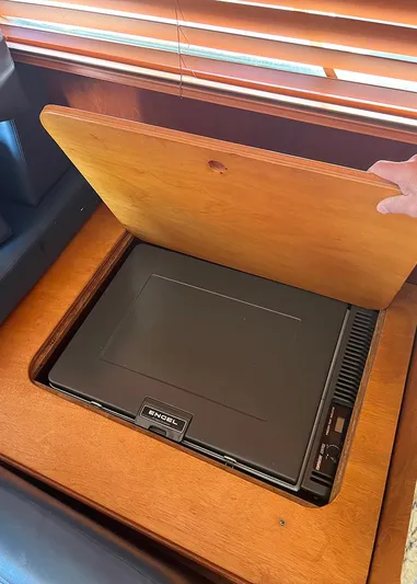  Yacht Photos Pics 1987 DeFever Tri-Cabin interior with hidden Engel fridge under wooden panel.