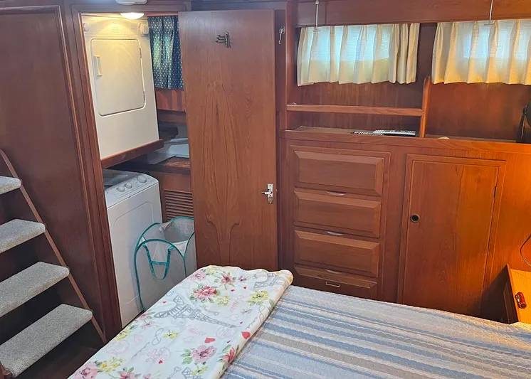  Yacht Photos Pics 1987 DeFever Tri-Cabin interior with wood cabinetry, bed, and laundry area.