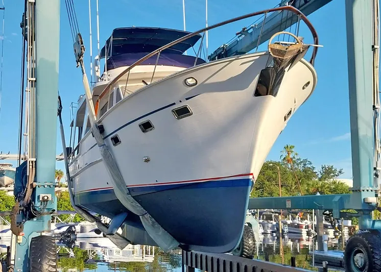  Yacht Photos Pics 1987 DeFever Tri-Cabin yacht in dry dock, showcasing its sleek design and structure.