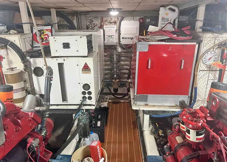  Yacht Photos Pics Engine room of a 1987 DeFever Tri-Cabin yacht with machinery and equipment.