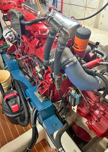  Yacht Photos Pics Engine room of a 1987 DeFever Tri-Cabin boat with visible machinery and components.