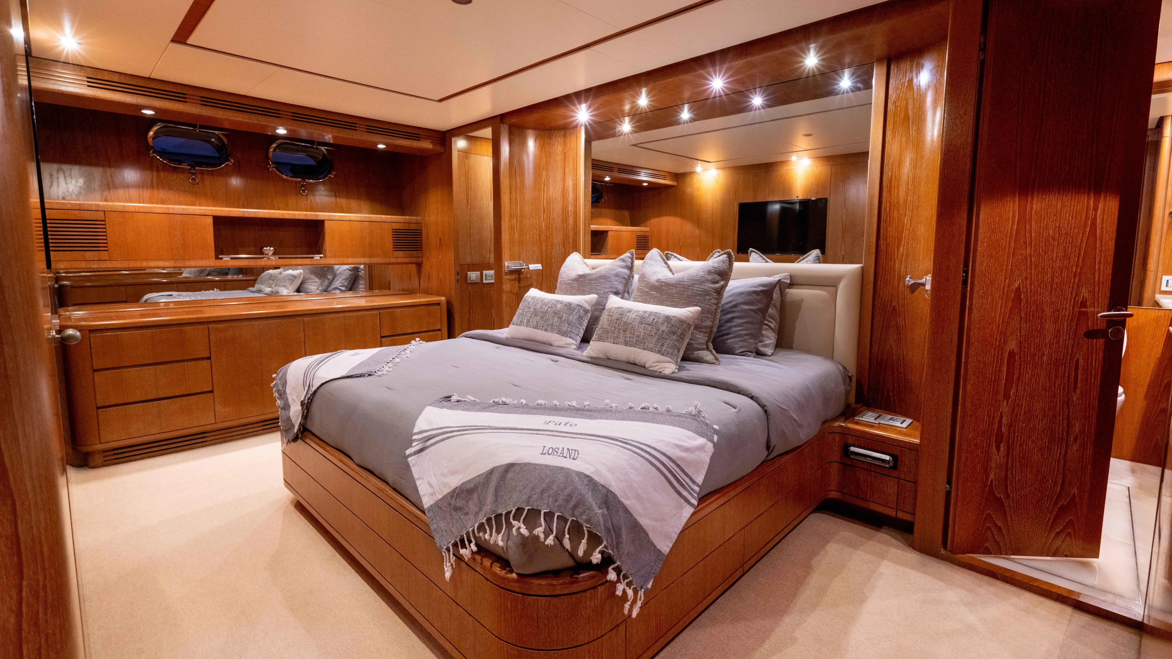 Losand Yacht Photos Pics Luxurious bedroom interior of 2005 Sanlorenzo SL82 yacht with elegant wood finishes.