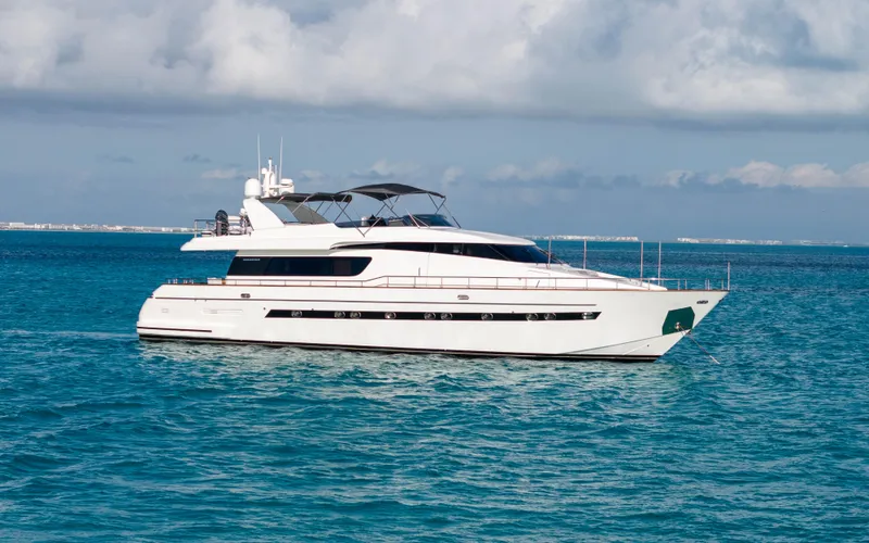 Losand Yacht Photos Pics Sanlorenzo SL82 2005 yacht on calm blue ocean waters under cloudy sky.