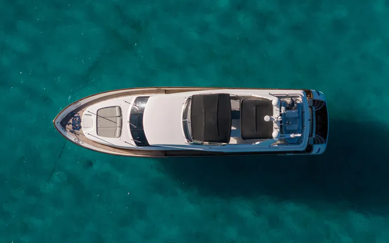Losand Yacht Photos Pics Sanlorenzo SL82 2005 yacht, aerial view over clear turquoise water.