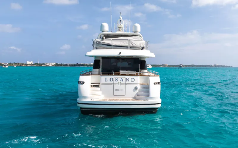 Losand Yacht Photos Pics Sanlorenzo SL82 yacht from 2005 on turquoise waters, rear view.