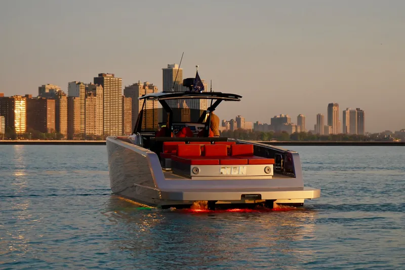  Yacht Photos Pics 2025 Pardo Yachts P43 cruising near city skyline at sunset.