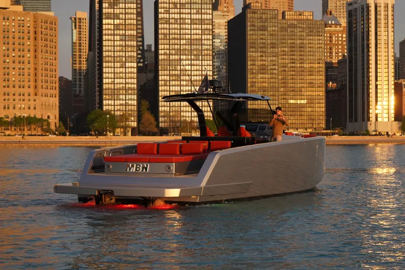  Yacht Photos Pics 2025 Pardo Yachts P43 cruising near city skyline at sunset.