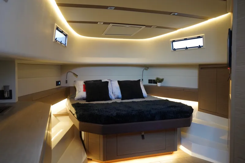  Yacht Photos Pics Luxurious interior cabin of 2025 Pardo Yachts P43 with modern lighting and cozy bedding.