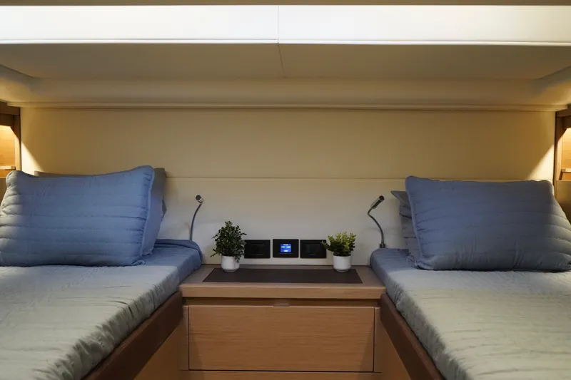  Yacht Photos Pics 2025 Pardo Yachts P43 cabin with twin beds, modern decor, and ambient lighting.