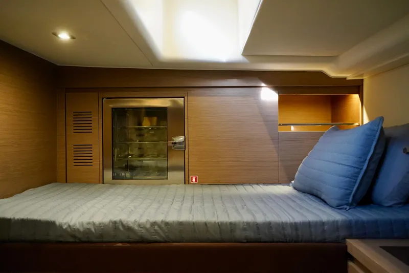  Yacht Photos Pics Luxurious cabin interior of 2025 Pardo Yachts P43 with modern bedding and wood finish.