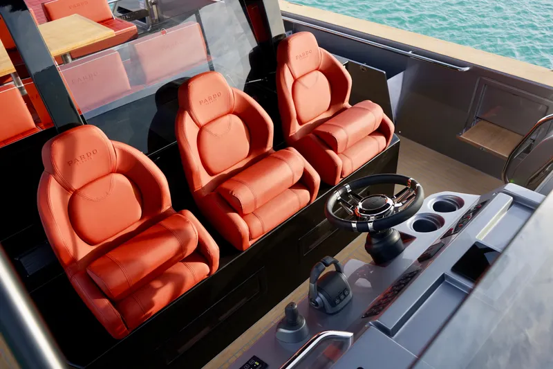  Yacht Photos Pics Luxurious red leather seats on 2025 Pardo Yachts P43, featuring modern helm and controls.