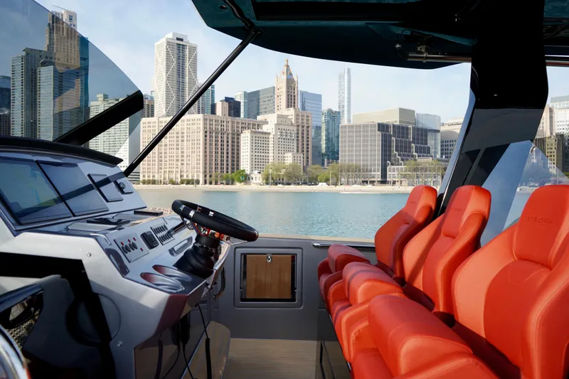  Yacht Photos Pics Interior of 2025 Pardo Yachts P43 with red seats, city skyline view.
