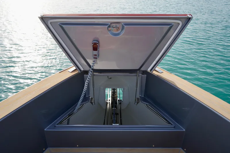  Yacht Photos Pics Open hatch on 2025 Pardo Yachts P43, revealing storage space, with ocean backdrop.