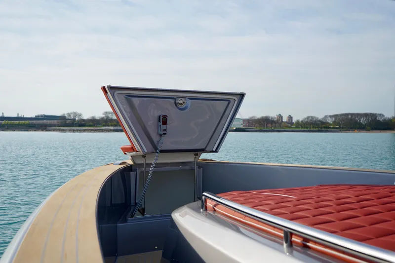  Yacht Photos Pics 2025 Pardo Yachts P43 with open hatch, red seating, and scenic waterfront view.