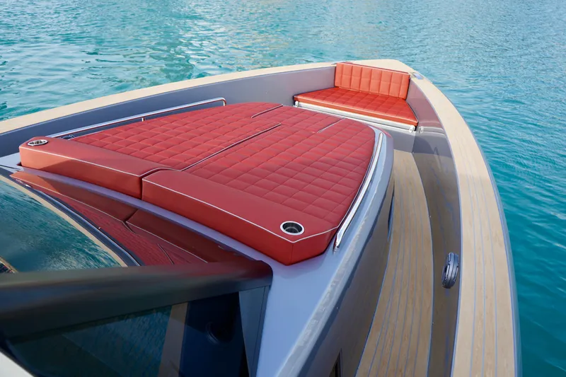  Yacht Photos Pics 2025 Pardo Yachts P43 with red cushioned deck, cruising on clear blue water.