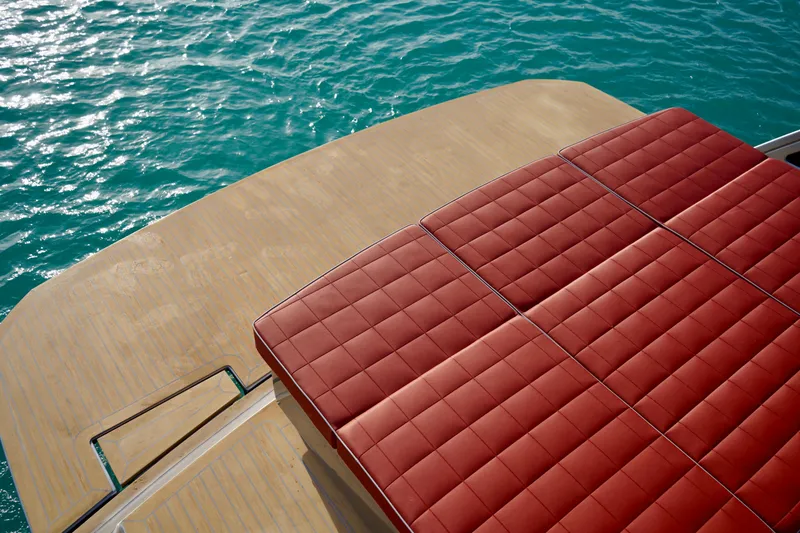  Yacht Photos Pics Luxury deck of 2025 Pardo Yachts P43 with red cushioned seating and ocean view.