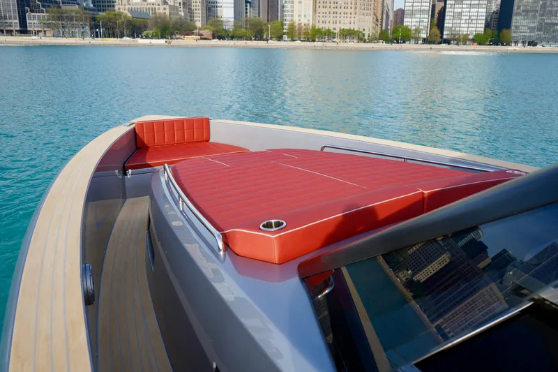  Yacht Photos Pics 2025 Pardo Yachts P43 with red seating, docked in a city harbor.