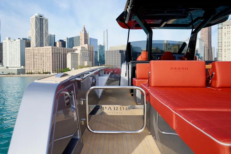  Yacht Photos Pics 2025 Pardo Yachts P43 luxury yacht with red seating, city skyline backdrop.