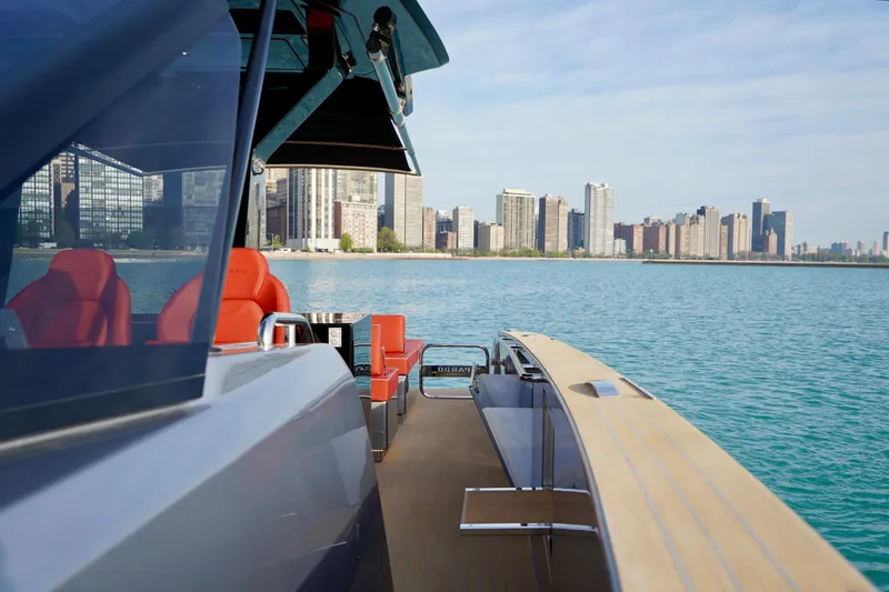  Yacht Photos Pics 2025 Pardo Yachts P43 cruising near city skyline on a sunny day.