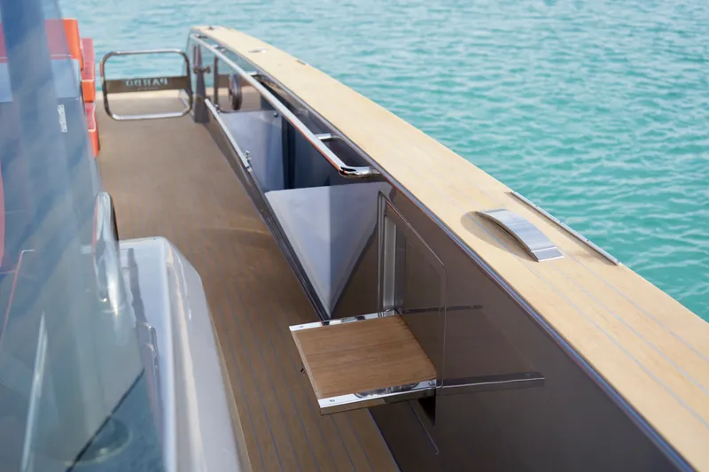  Yacht Photos Pics 2025 Pardo Yachts P43 deck with sleek design and wooden accents, overlooking turquoise water.