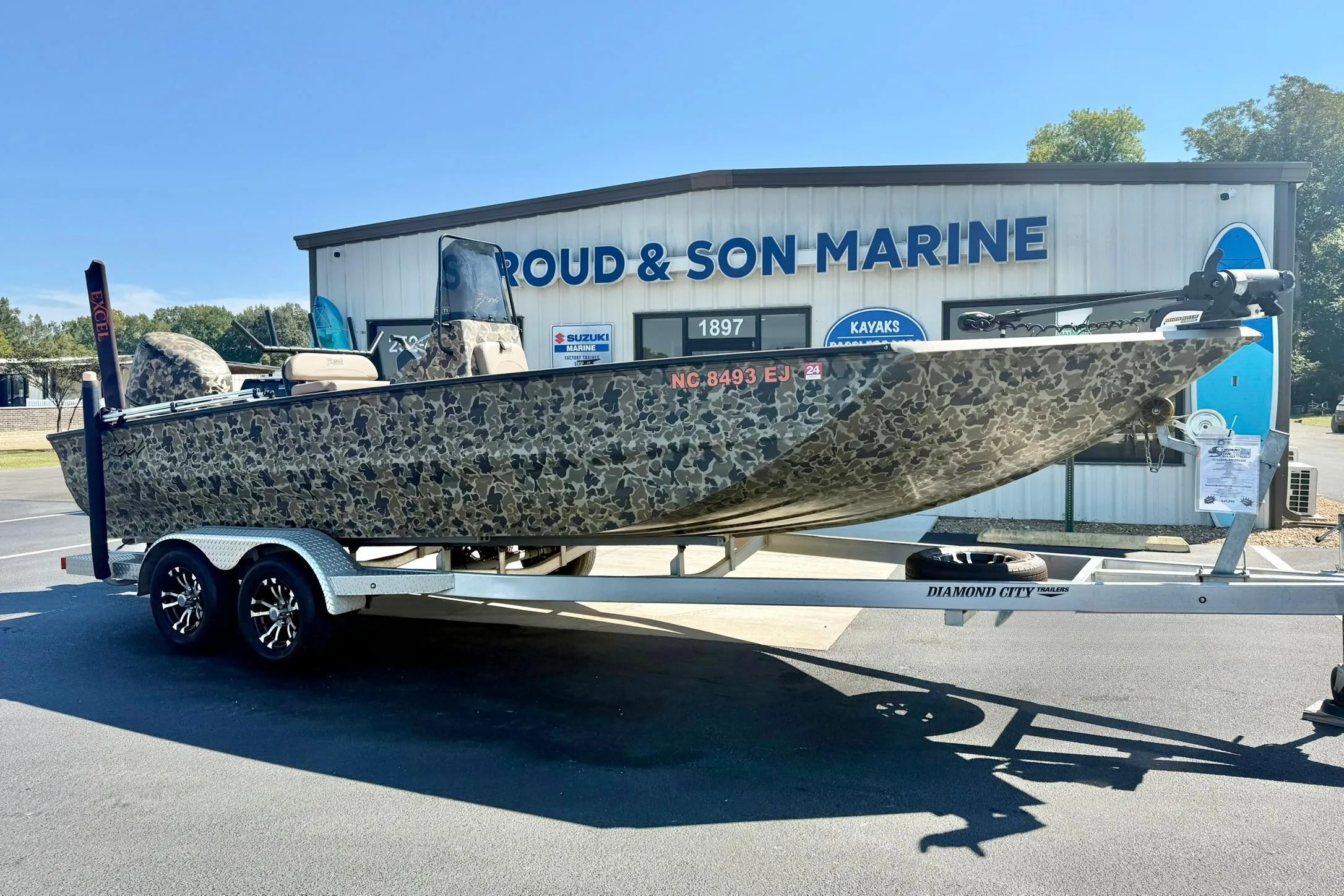 2019 Excel 230 Bay Pro boat on trailer at Stroud & Son Marine dealership.
