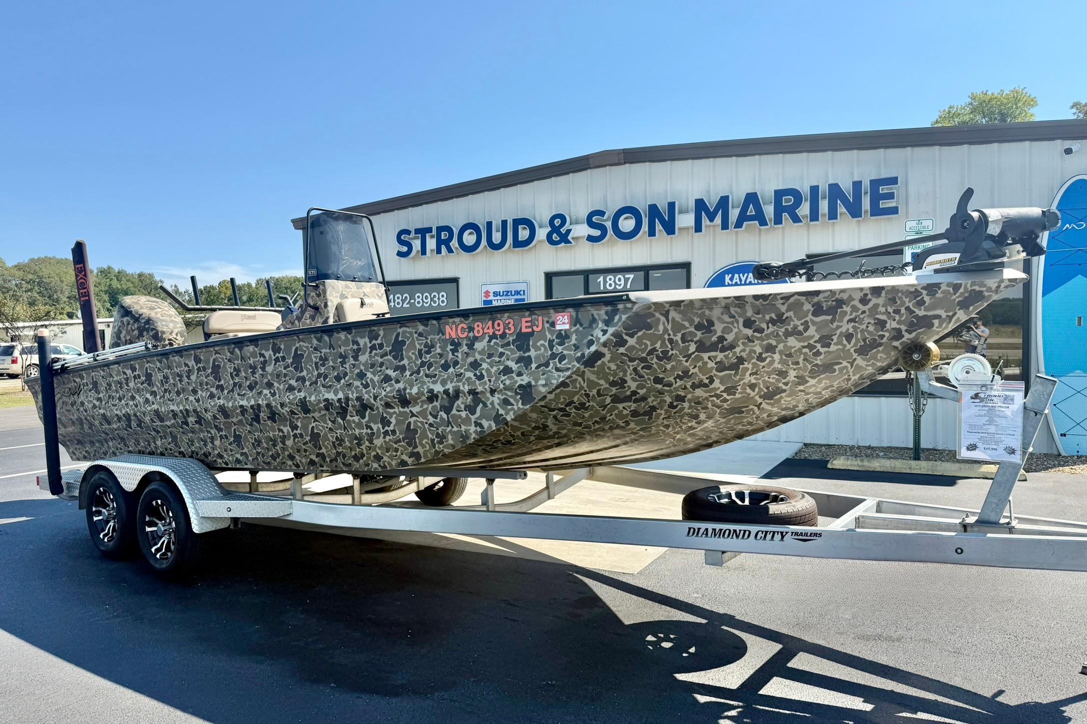 2019 Excel 230 Bay Pro boat on trailer at Stroud & Son Marine dealership.