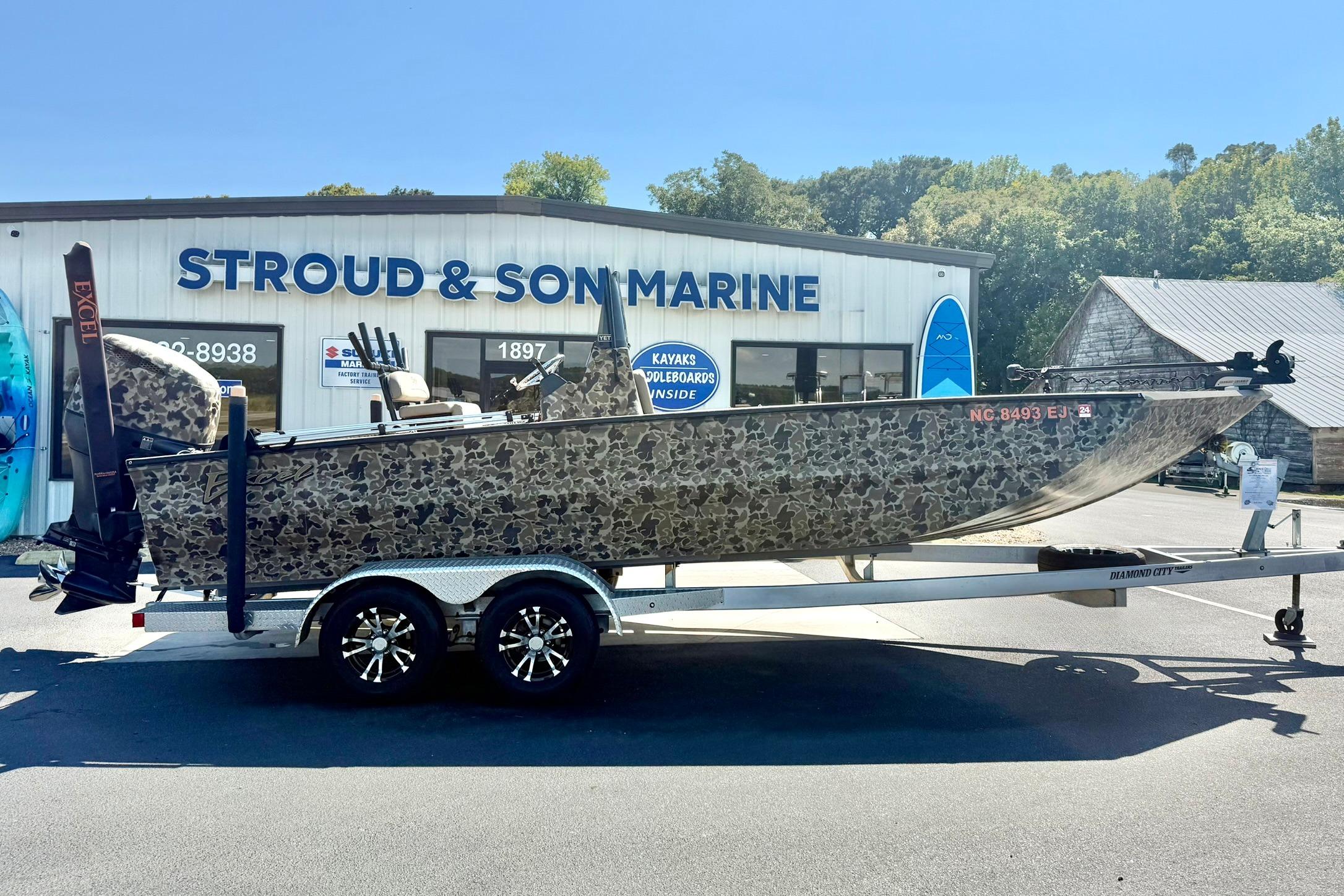 2019 Excel 230 Bay Pro boat on trailer at Stroud & Son Marine dealership.