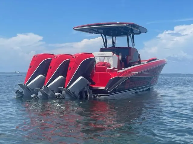  Yacht Photos Pics 2024 Statement 350 Open boat with triple engines on calm water.