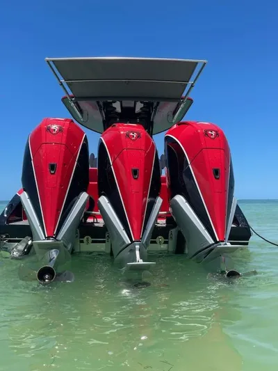  Yacht Photos Pics 2024 Statement 350 Open boat with three powerful red outboard engines.