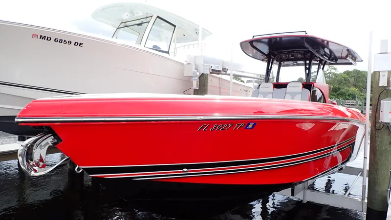  Yacht Photos Pics Red 2024 Statement 350 Open boat docked beside another vessel.