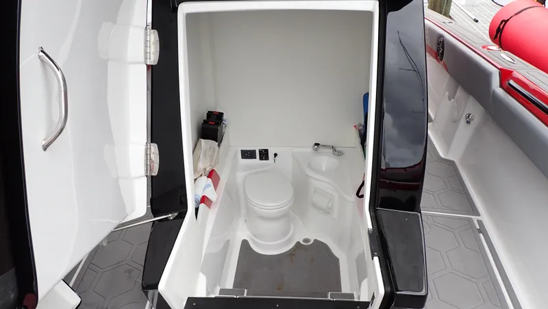  Yacht Photos Pics 2024 Statement 350 Open boat interior with compact bathroom amenities.