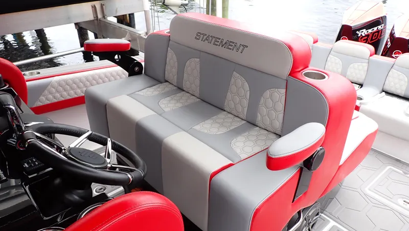  Yacht Photos Pics 2024 Statement 350 Open boat interior with red and gray seating, featuring modern design.