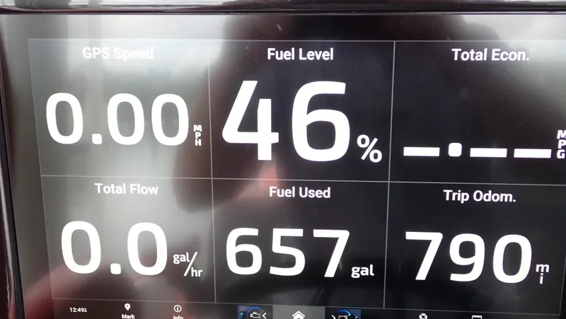  Yacht Photos Pics Dashboard display of 2024 Statement 350 Open showing fuel level, speed, and trip data.