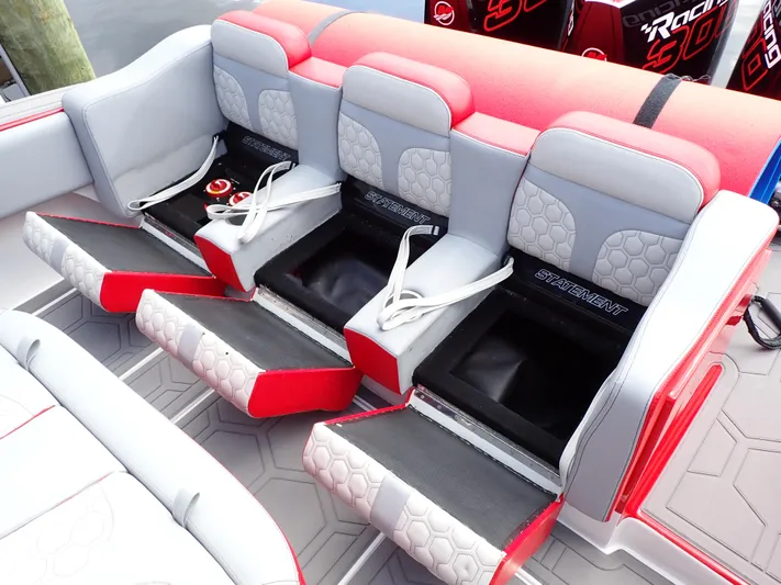  Yacht Photos Pics 2024 Statement 350 Open boat seating with storage compartments and red accents.