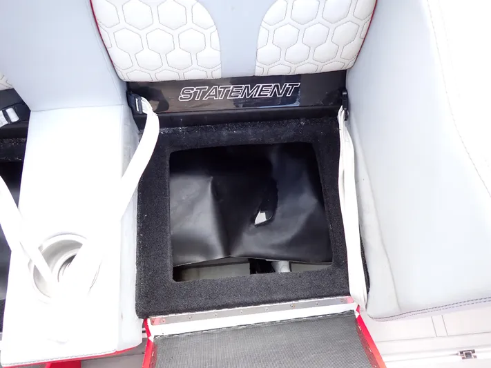  Yacht Photos Pics 2024 Statement 350 Open boat seat storage compartment with cup holder and hexagonal pattern.
